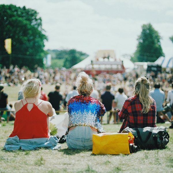 Students Sitting Down At A Local Festival